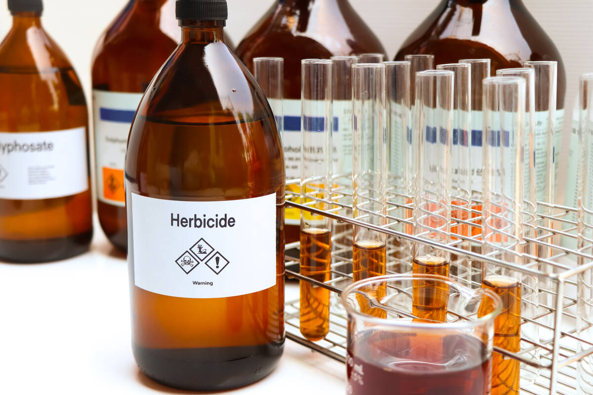 Herbicides in glass bottles, used to manage wasteland or control weeds in agriculture, laboratory experiment, test tubes. Kittisak Kaewchalun/iStock/Getty Images