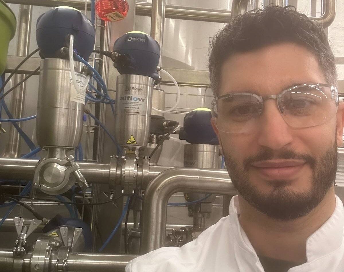 Andrew Chiappetta of Launch Bioindustries beside a bioreactor. Photo: Courtesy Launch Bioindustries